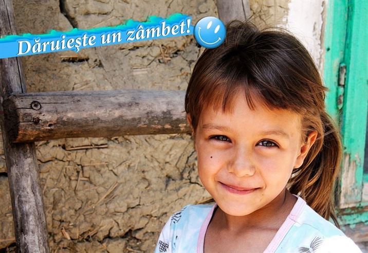 Daruieste un zambet unui copil